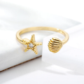 Anillo Ajustable Estrella de Mar con Cristal y Concha en Acero Dorado